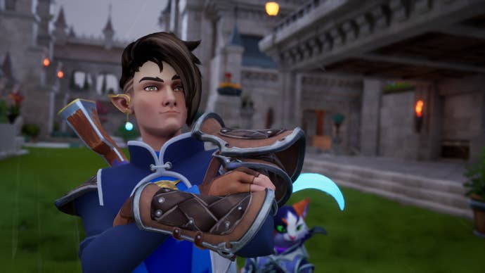 An elven character in a blue uniform stands satisfied with his arms cross in a medieval castle arena in Orcs Must Die Deathtrap