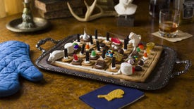 A gameboard and playing pieces made out of dough and sugar on a tray