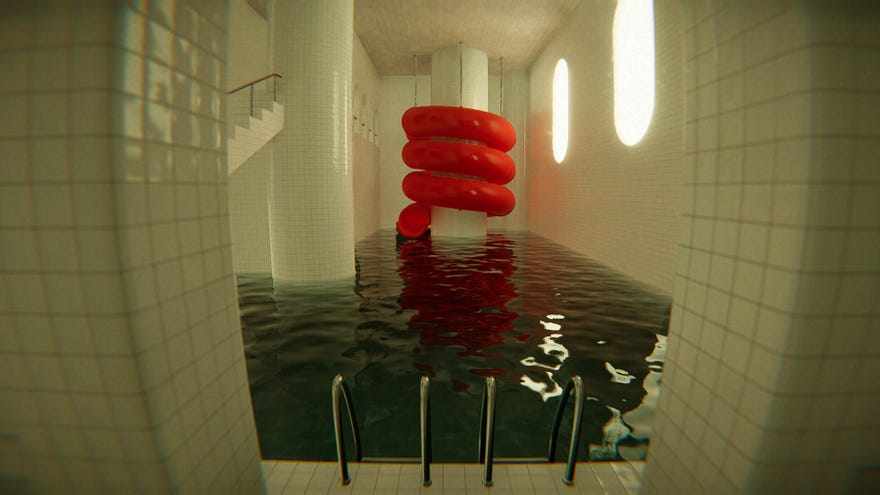 A spiralling red water slide over an indoors pool made of white tiles