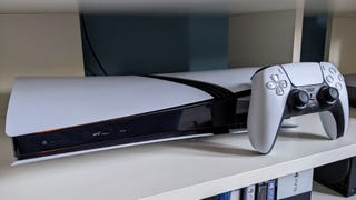 A photograph of the PS5 Pro and Dualsense controller.