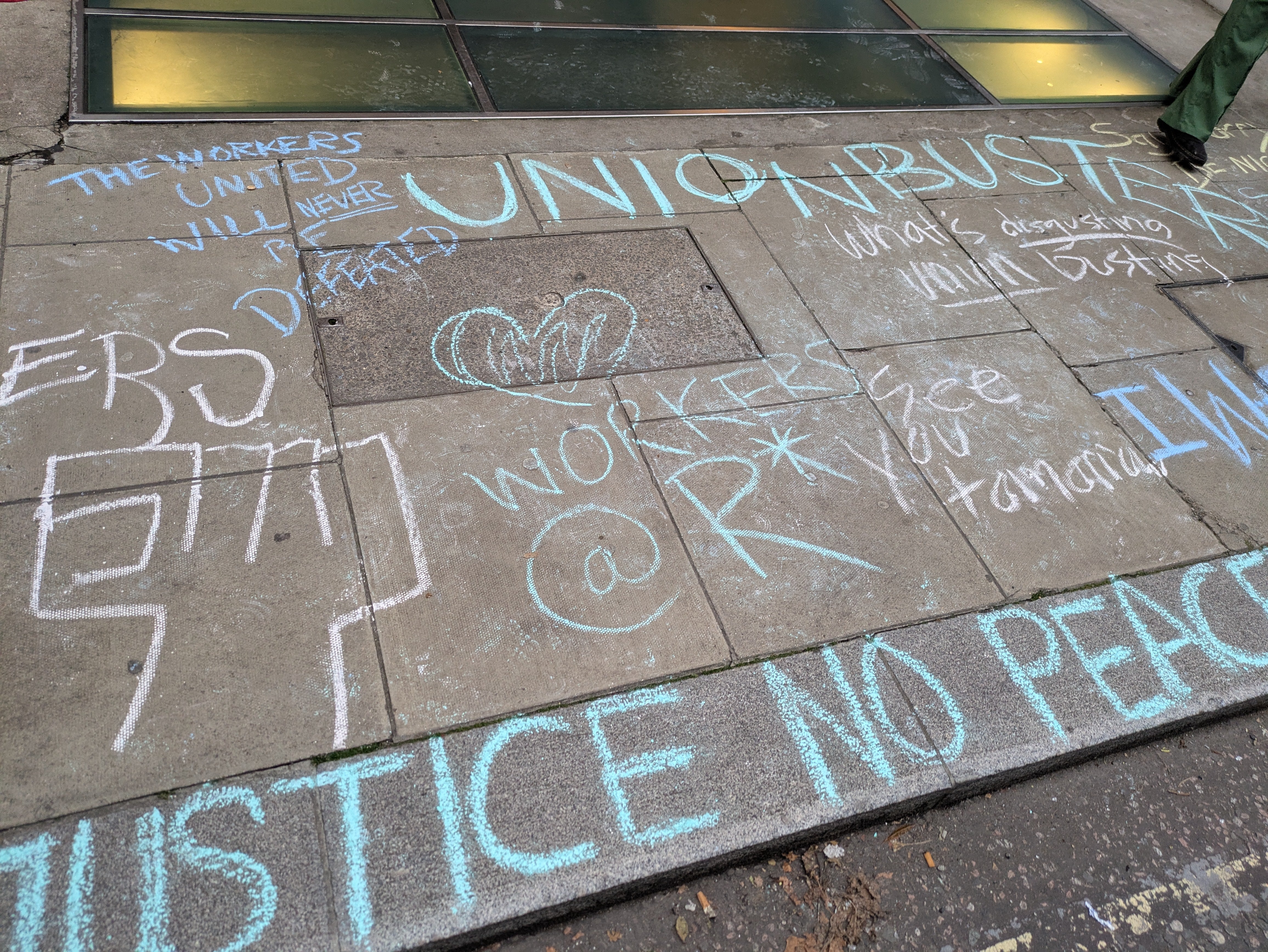 Pavement chalk messages of support for laid-off Rockstar workers outside Take-Two Interactive's offices in London. - 4