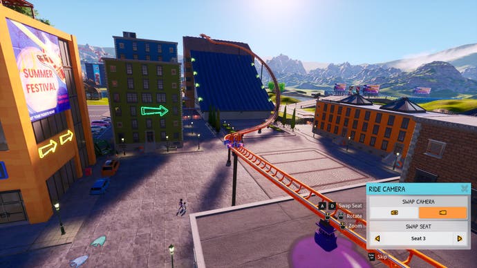 Screenshot of Park Beyond, showing the ride camera view of a track about to swoop up the side of a building