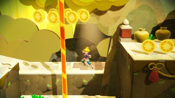 Kung Fu Peach stands on a spotlight behind a pole in Princess Peach: Showtime