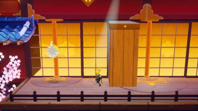 Ninja Peach stands beside a rotating door that once hid away a Sparkle Gem in Princess Peach: Showtime