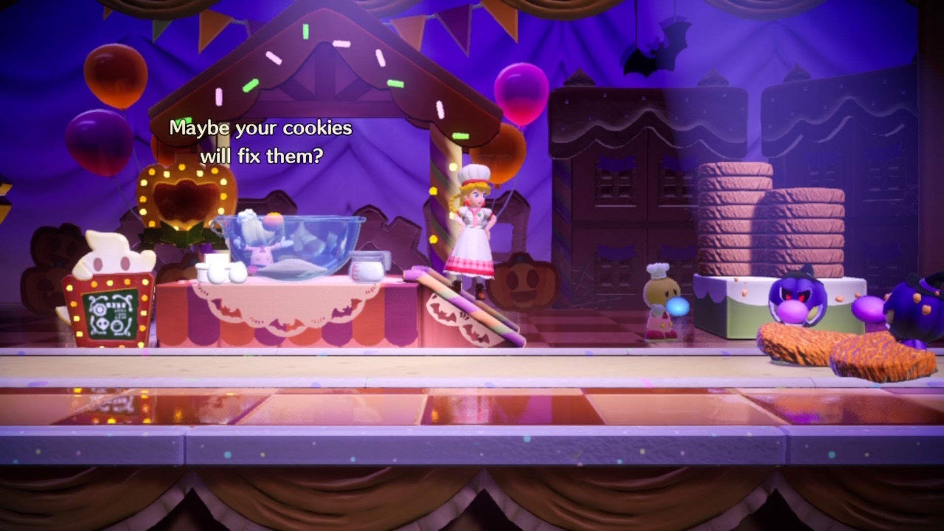 Patissiere Peach stands beside a cookie-baking stand with some possessed Theets to her right in Princess Peach: Showtime - 5