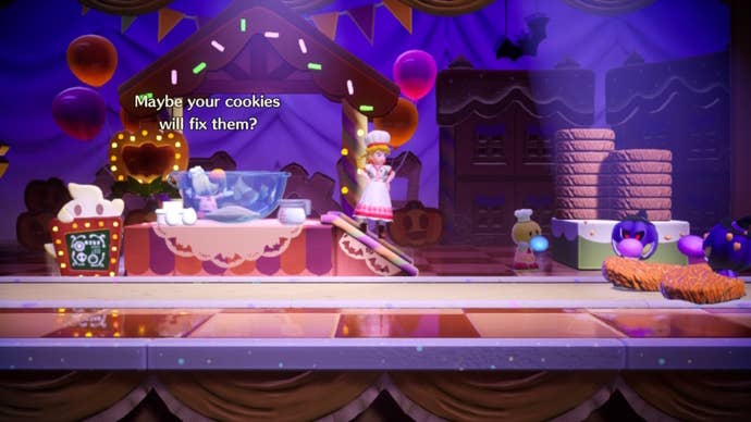 Patissiere Peach stands beside a cookie-baking stand with some possessed Theets to her right in Princess Peach: Showtime