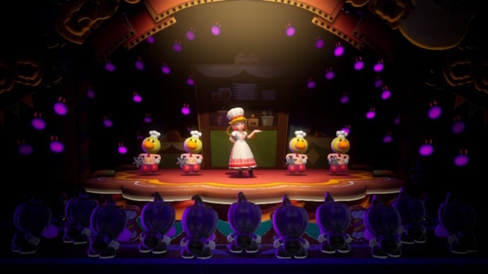Patissiere Peach stands on stage with some baker Theets in Princess Peach: Showtime