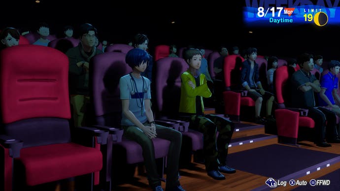 A screenshot from Persona 3: Reloaded shows the leader sitting in a crowded movie theater with a friend.