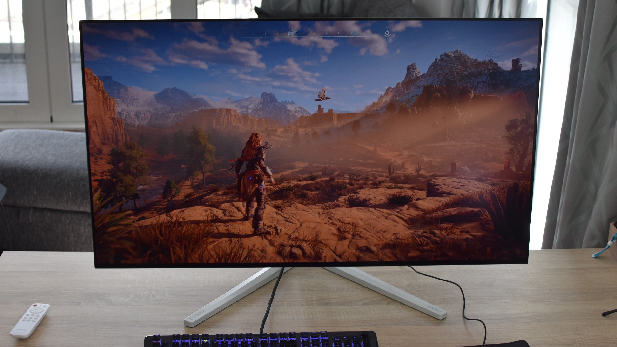 Horizon Zero Dawn running on the Philips Evnia 42M2N8900 gaming monitor.