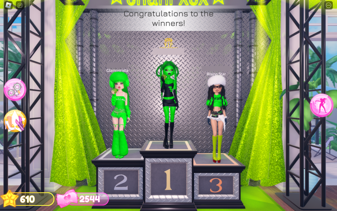 A podium finish for the theme &lsquo;Brat&rsquo; in dress to impress. The players are all women dressed in bright green outfits. The winner has green skin, holds an apple, and is wearing a cut-out black dress.