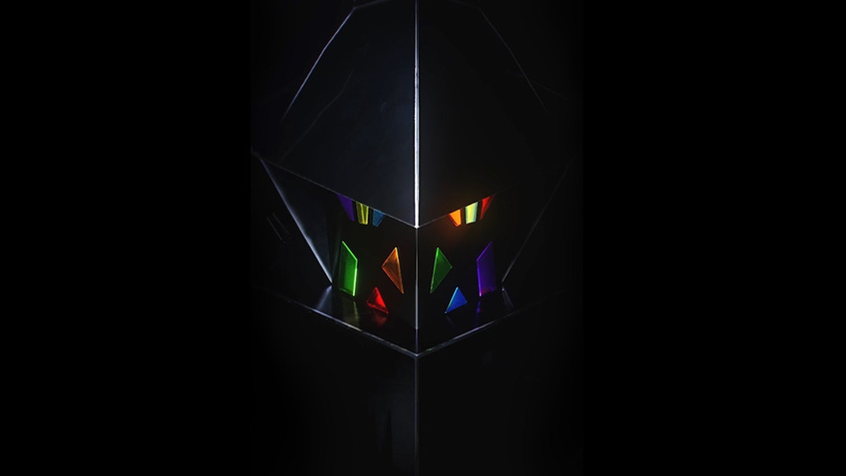 Necrozma&rsquo;s face from Pokemon Go on a dark black background.