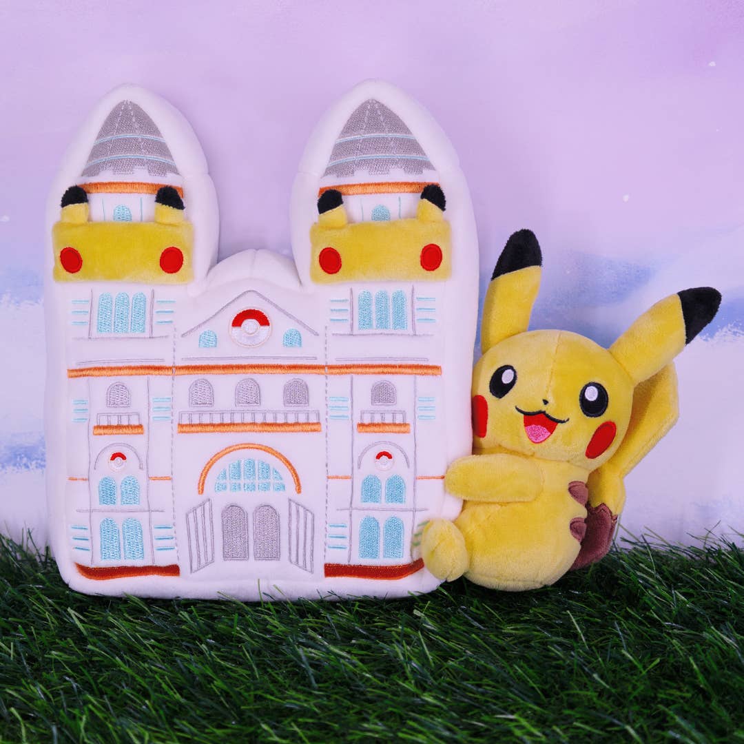 A plushie of a Pikachu hugging the Natural History Museum