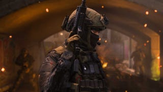 A screenshot of an Operator from Modern Warfare 3, standing with their gun raised as embers flicker in the background.