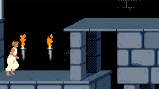 The Prince of Persia runs through a torchlit dungeon