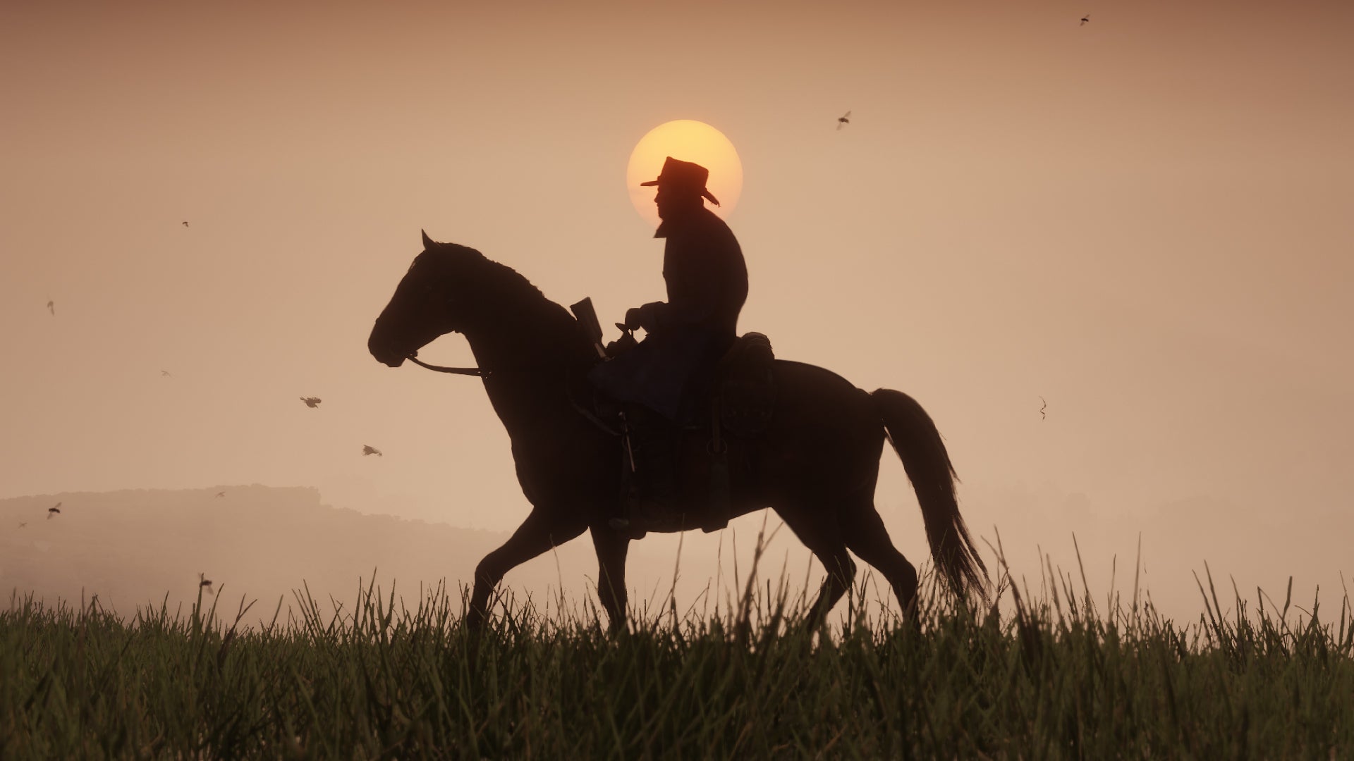 Arthur rides on horseback through the sunset in Red Dead Redemption 2 - 1