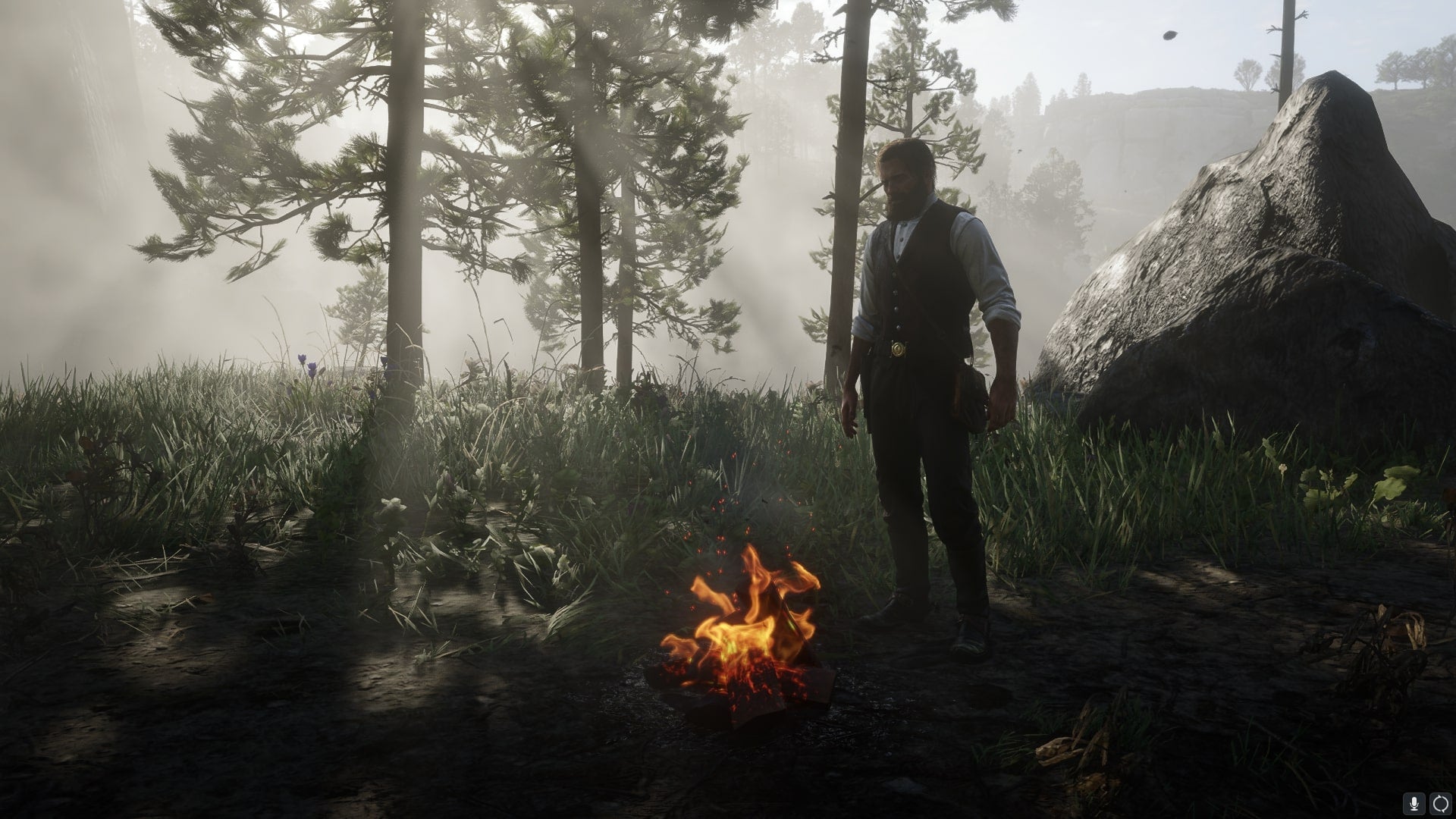 Arthur Morgan stands beside a campfire in a forest in Red Dead Redemption 2 - 1