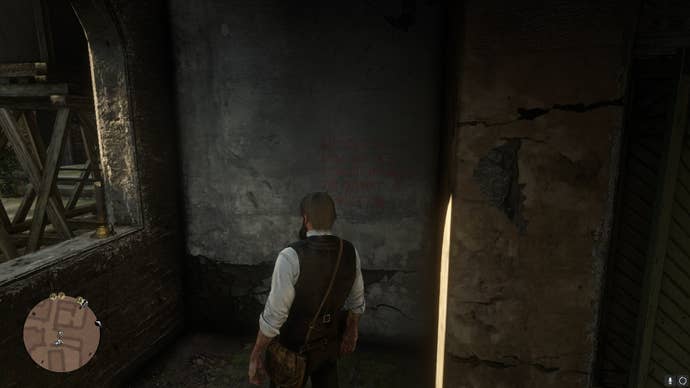 Arthur looks at some vampire-related graffiti carved into a wall in Red Dead Redemption 2's Saint Denis