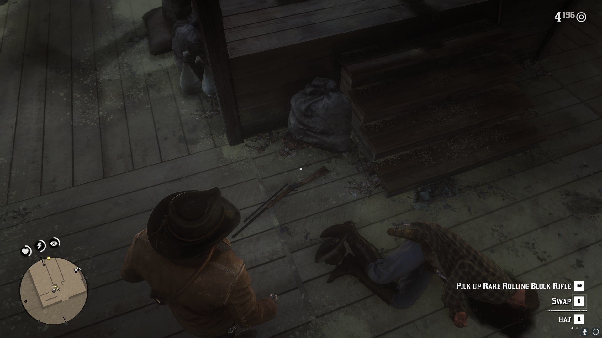 Arthur looks down at the rare rolling back rifle on the ground after killing the man wielding it in a barn in Red Dead Redemption 2 - 7