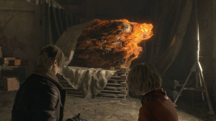 Leon and Ashley look at a big rock of amber in Resident Evil 4 Remake