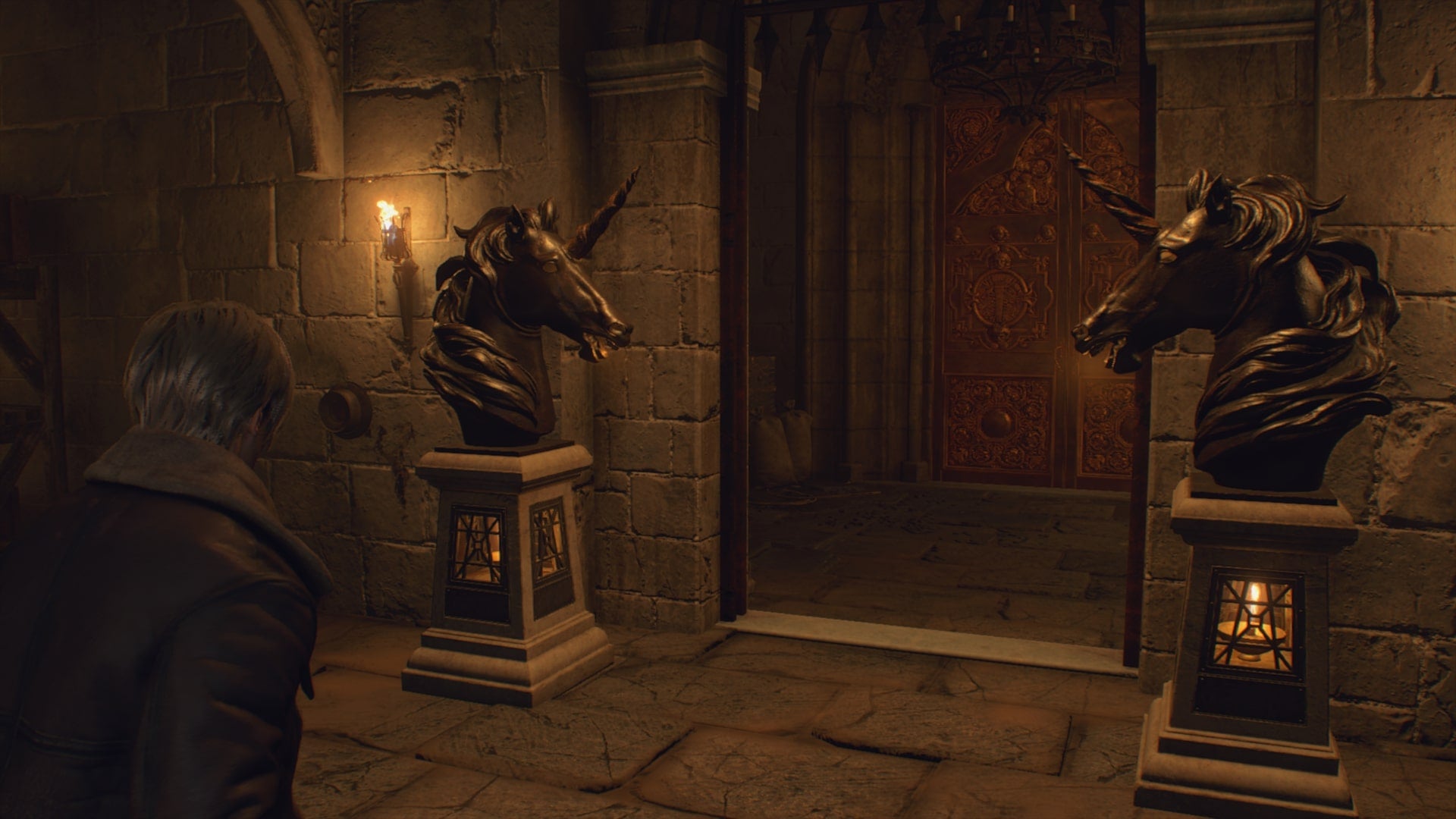 Leon looks at the Antechamber Door which is surrounded by two unicorn statues in Resident Evil 4 Remake - 4