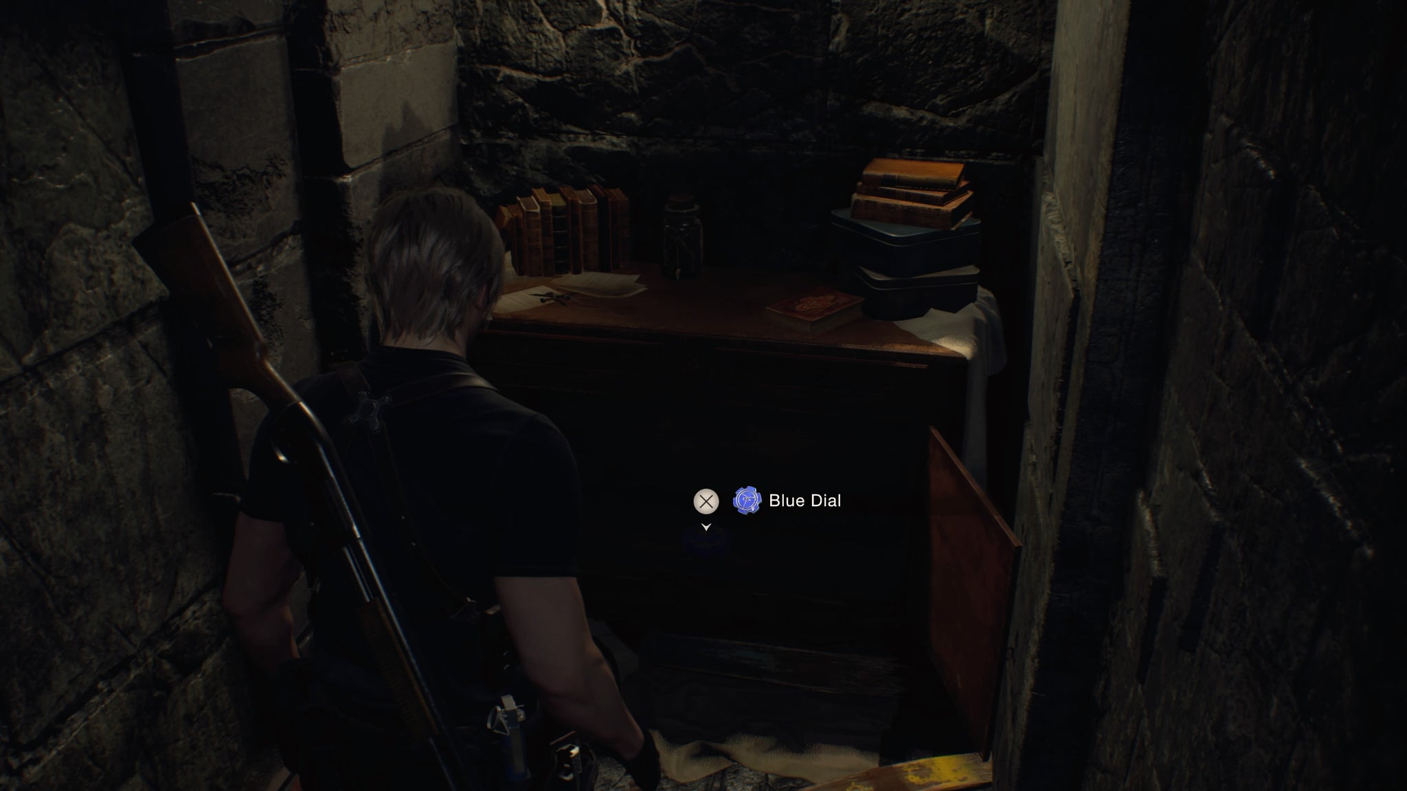 Leon finds the blue church dial in a cupboard in Resident Evil 4 Remake - 13