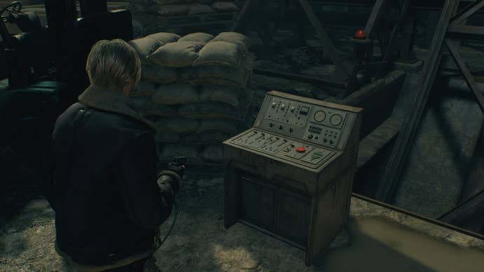 Leon looks at a control panel in Resident Evil 4 Remake