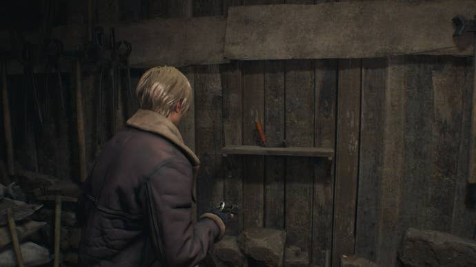 Leon looks at a crank in Resident Evil 4 Remake