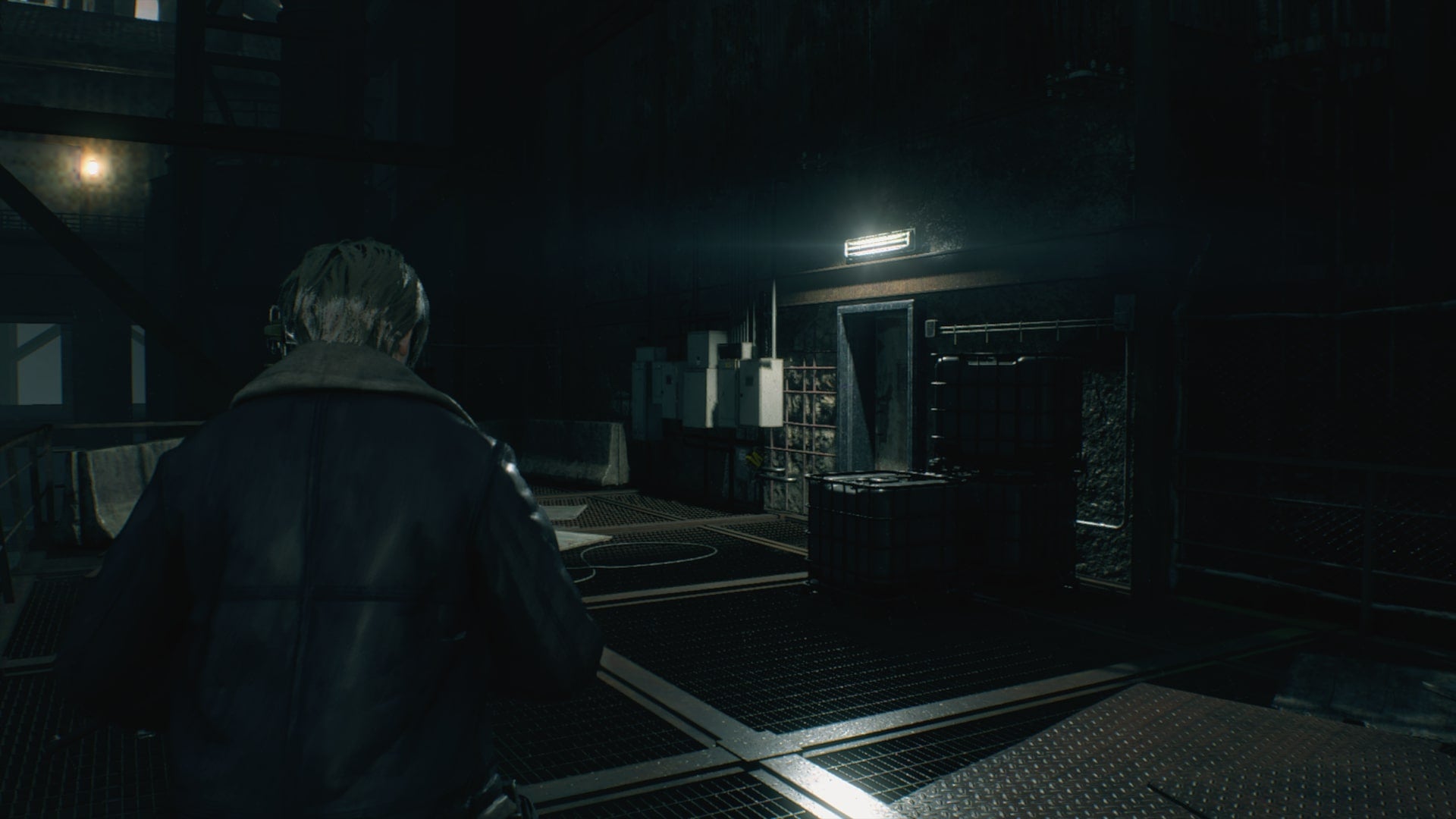 Leon looks toward a facility door with a landmine in front of it in Resident Evil 4 Remake - 5