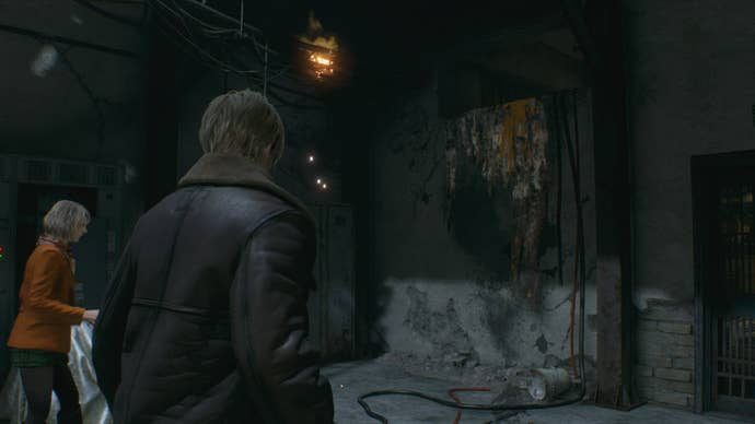 Leon and Ashley look at a gap in the wall that Ashley can climb up in Resident Evil 4 Remake