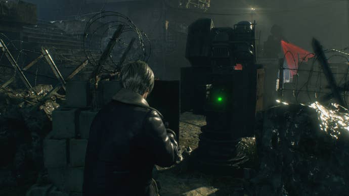 Leon looks at a moveable laser gate in Resident Evil 4 Remake