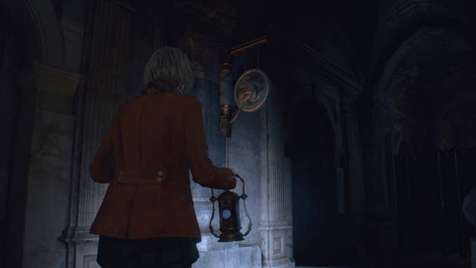 Ashley looks up at the Mausoleum gongs in Resident Evil 4 Remake