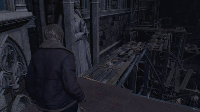 Leon looks toward some wooden planks that are not sturdy in Resident Evil 4 Remake