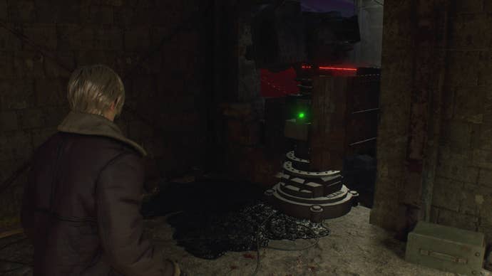 Leon faces a laser in Resident Evil 4 Remake