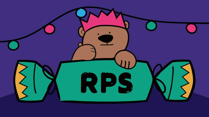 Horace the bear in a lovely paper crown hat, resting his paws on a giant green Christmas Cracker, with RPS printed on it. He’s giving you the thumbs up
