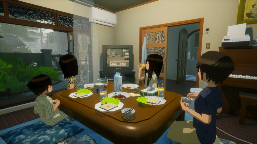 A family sit around a low table eating breakfast in Rainy Season