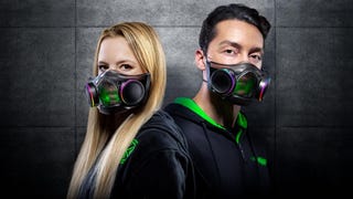 A man and woman modelling the Razer Zephyr face mask,