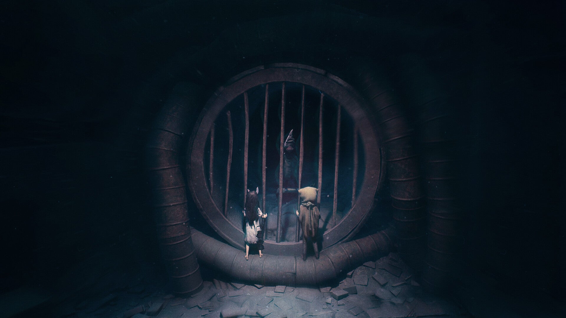 A little girl and boy in crepy hats peering through a huge barred tunnelmouth at a shadowy figure - 1