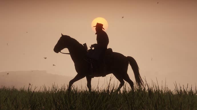Red Dead Redemption 2 representation showing a silhouette of Arthur Morgan riding crossed a tract astatine sunset.