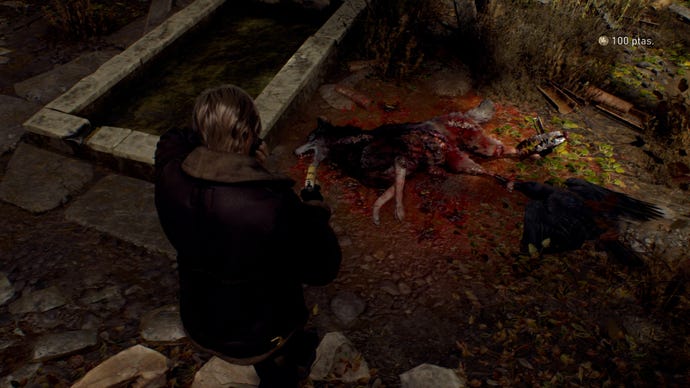 Leon looks at a dead dog who was caught in a bear trap in the Resident Evil 4 remake.