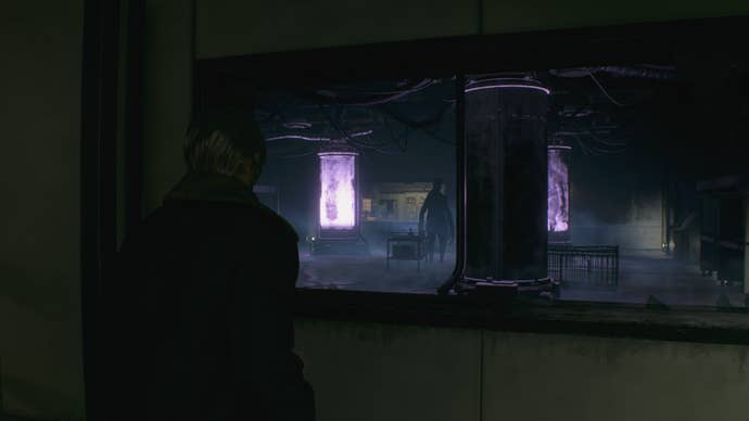 Leon looks at an Iron Maiden in the incubation lab of Resident Evil 4 Remake