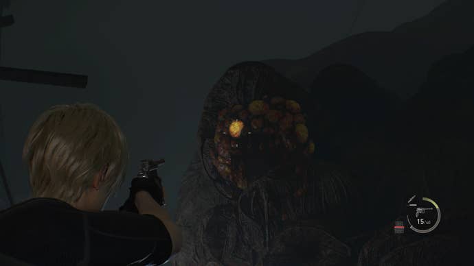 Leon points his gun at an entrance to the Insect Hive in Resident Evil 4 Remake