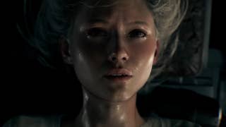 Grace, the lead character from Resident Evil 9, is seen uncomfortable and distressed while strapped upside down to a bed.