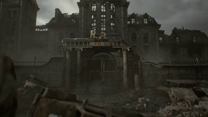 A city in ruin, a building with the large letters R.P. above it, falling off.