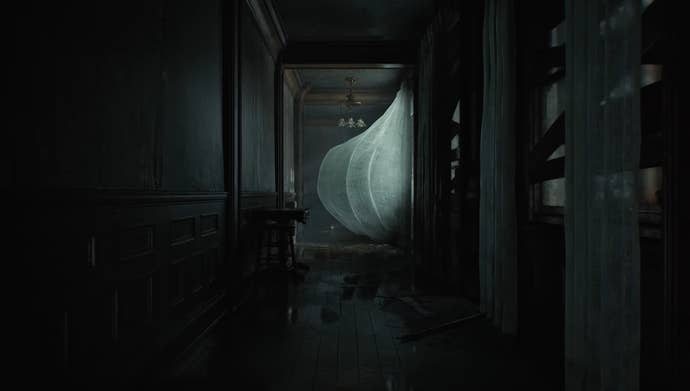 A acheronian corridor pinch a curtain blowing successful nan wind.