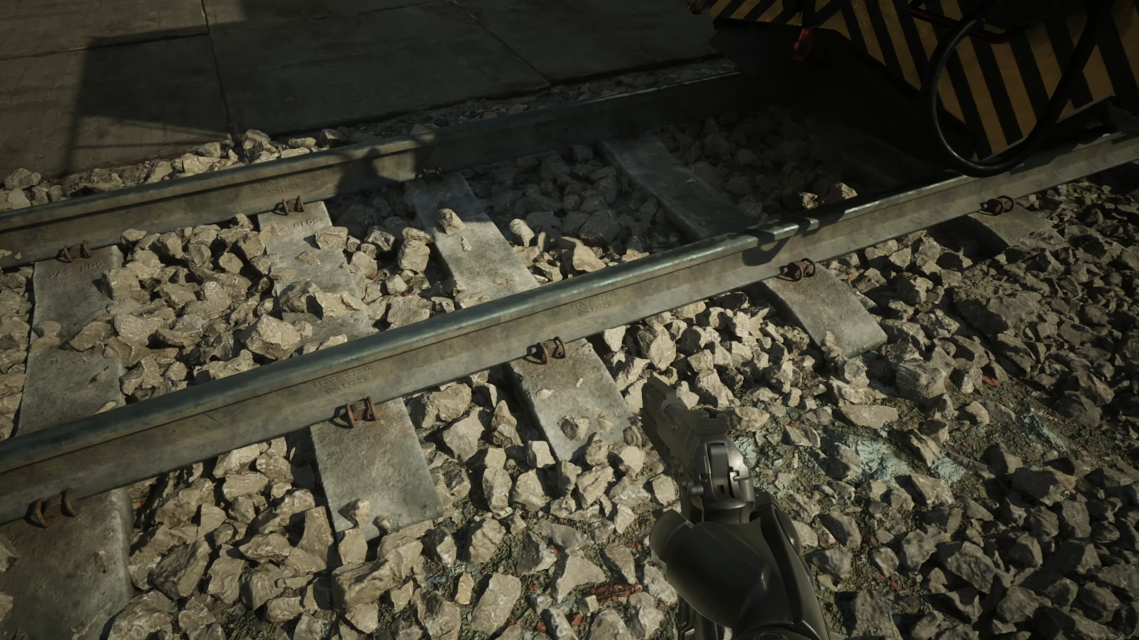robocop: rogue city screenshot showing nanite and vsm producing a natural environment with pebbles under railway tracks