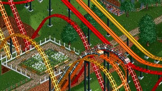 Screenshot of RollerCoaster Tycoon Classic showing competing red, orange, and yellow coasters