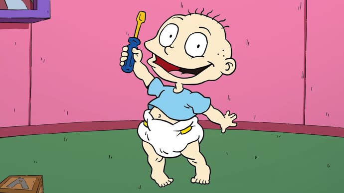 Rugrats Adventures in Gameland trailer screenshot showing cartoon baby holding a screwdriver