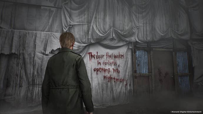 James Sunderland faces a wall that reads, “The door that wakes in darkness, opening into nightmares,” in the Silent Hill 2 remake