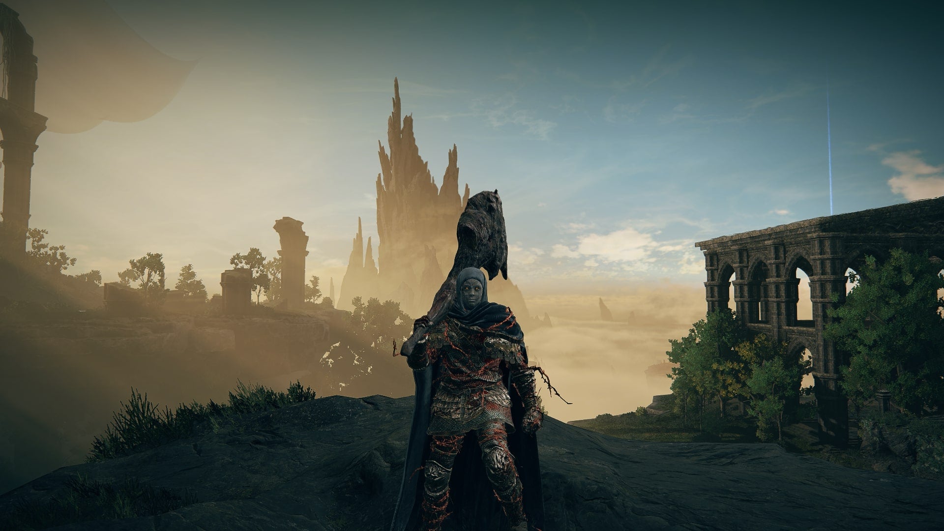 The Tarnished wields the Bloodfiend's Arm while standing in the Ancient Ruins of Rauh in Elden Ring Shadow of the Erdtree - 1