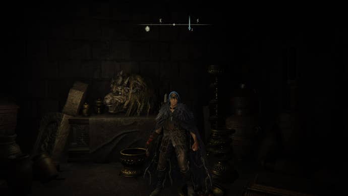 The Tarnished stands by a Divine Beast Head in the Belurat Tower Settlement Storeroom in Elden Ring Shadow of the Erdtree